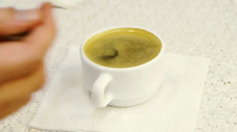 Serving espresso coffee (adding sugar) Stock-Footage 1056644