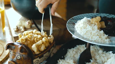 Serving feijoada, a Brazilian dish on a lunch table Video stock 163943103