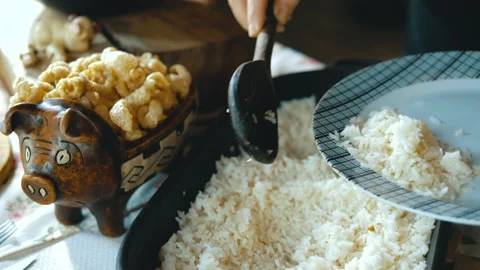Serving feijoada, a Brazilian dish on a lunch table Video stock 163943142