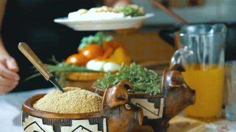 Serving feijoada, a Brazilian dish on a lunch table Stock Footage 163943319