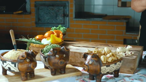 Serving feijoada, a Brazilian dish on a lunch table Stock Footage 163944178