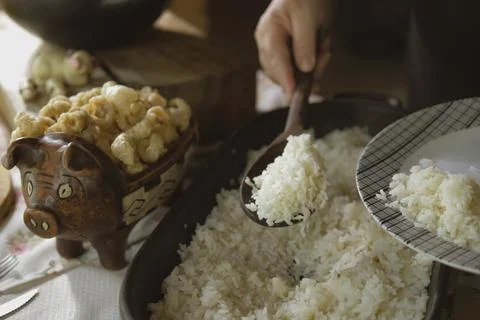 Serving feijoada, a Brazilian dish on a lunch table Stock Photos