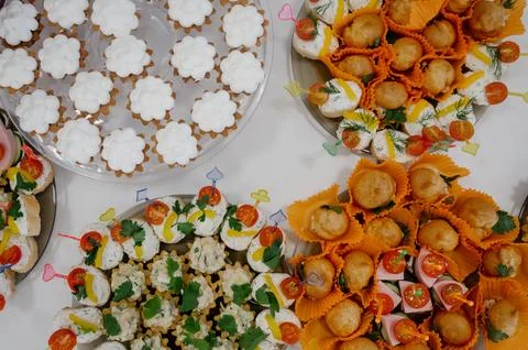 Serving a festive table with bruschetta, cherry tomatoes, and pastry baskets Stock Photos