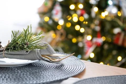 Serving festive table with plates, forks, knives, napkins for Christmas Foto stock