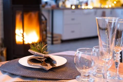 Serving festive table with plates, forks, knives, napkins, glasses close-up.. Stock-Fotos