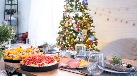 Serving a festive table with snacks, salads and goodies close-up in the mod.. Foto stock