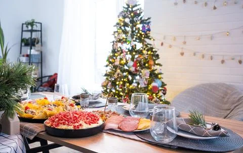 Serving a festive table with snacks, salads and goodies close-up in the mod.. 스톡 사진