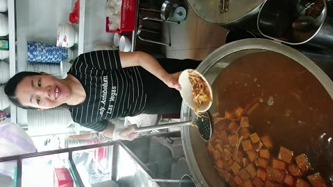 Serving fish cake noodle soup in Da Nang, Vietnam Stock Footage 248451264