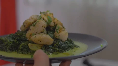 Serving a Fish dish with spinach Video stock 111967444