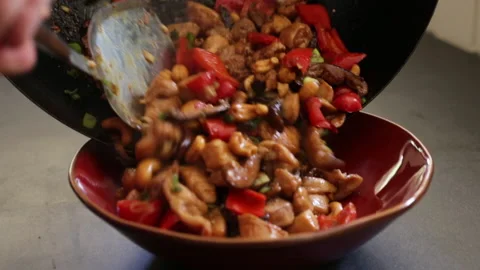 Serving A Fresh And Ateaming Hot Chicken Stir-Fry Stock Footage 232970648