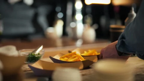 Serving fresh food at a bustling event in an inviting atmosphere Stock Footage 323931769