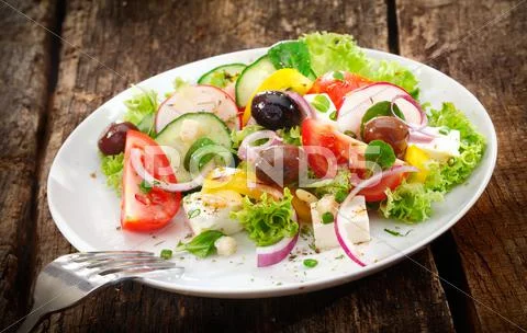 Serving of fresh mixed salad Stock Photos