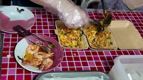 Serving Fresh Pad Thai Into Takeaway Boxes Thai Street Food Close-Up 4K Stock Footage 333189299
