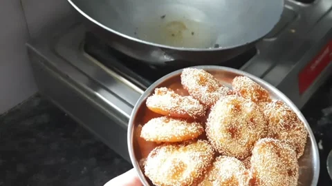 Serving Freshly Cooked Rice Flour and Jaggery Dessert on Plate Stock Footage 336488979