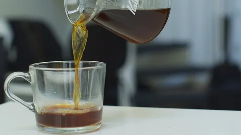 Serving freshly made coffee into the cup Stock Footage 108908799