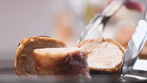 Serving freshly prepared bacon wrapped pork tenderloin. Stock Footage 152518324