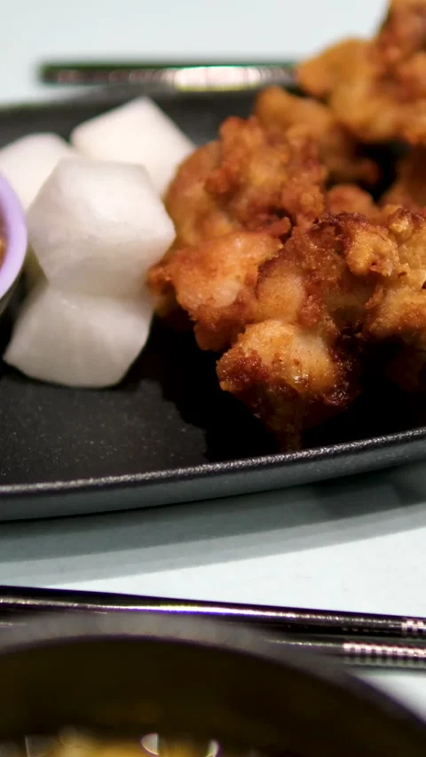 Serving fried chicken wings buffalo in chili barbecue sauce at restaurant Stock Footage 303488501