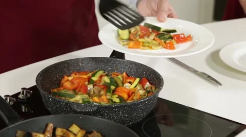 Serving fried vegetables on a plate Stock Footage 49783181