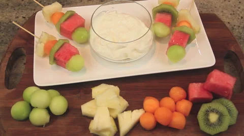 Serving Fruit Kebabs  With Yogurt Stock Footage 61200906