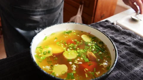 Serving ginger and onion soup. Video stock 178369357