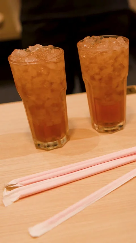 Serving Glasses of Iced Tea with Crushed Ice on Restaurant Table Stock Footage 346009354