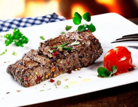 Serving of grilled beef steak Stock Photos