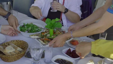 Serving grilled fish with traditional appetizers Stock-Footage 332077142