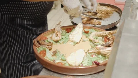 Serving grilled seafood: fish and shrimps Stock Footage 71058178