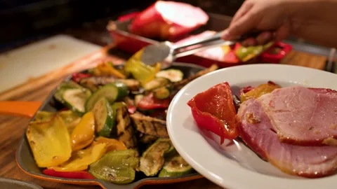 Serving Grilled Vegetables and Roast Ham at a Buffet Dinner Stock Footage 334698224