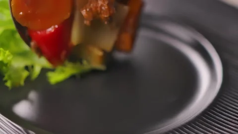 Serving hearty beef stew with vegetables on a plate Stock Footage 316087020