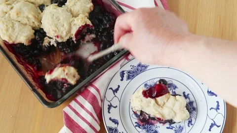 Serving up a helping of blueberry cobbler Stock Footage 92535582