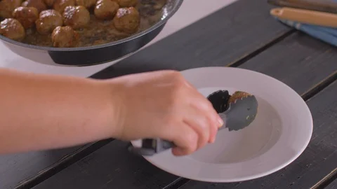 Serving home-made meatballs in a plate Stock Footage 112178347