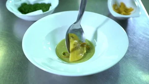 Serving Homemade ravioli in a dish Stock Footage 71602703
