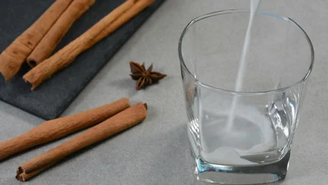 Serving hot cinnamon milk Stock Footage 133803424