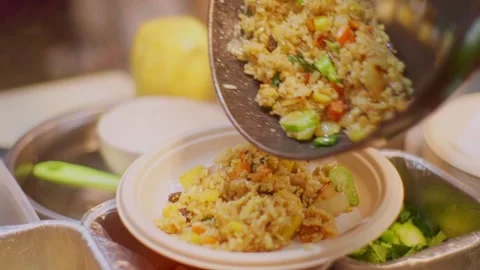 Serving Hot Fried Rice into Takeout Bowl – Asian Street Food Close-Up Stock Footage 312542333