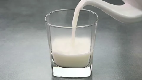 Serving hot milk Stock Footage 227693772