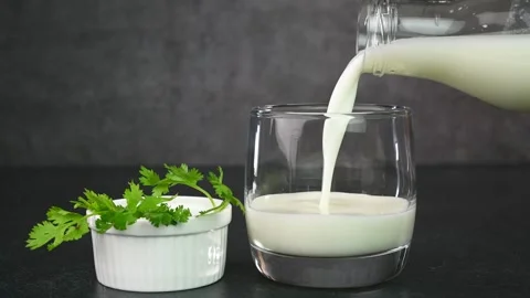 Serving Indian buttermilk Stock Footage 308314960