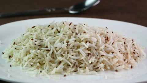 Serving jeera rice Stockbeeldmateriaal 237363714