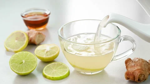 Serving lemon honey tea Stock Footage 226564776