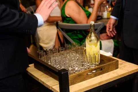 Serving limoncello in glasses Stock Photos
