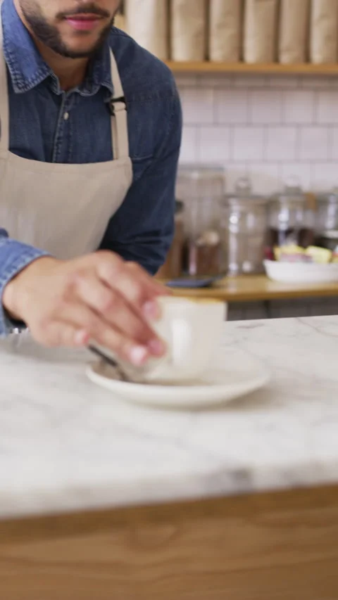 Serving, man and barista in cafe with coffee for customer order, service or Stock Footage 334921342