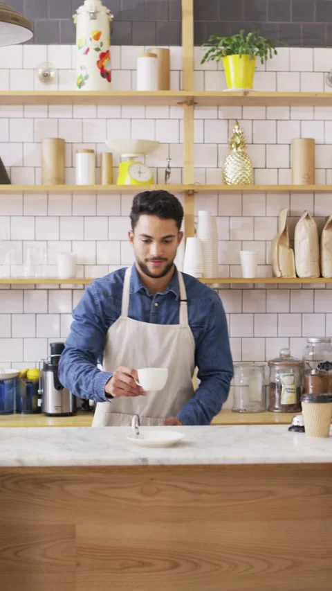 Serving, man and face of barista in cafe with coffee order, service or Stock Footage 334919861