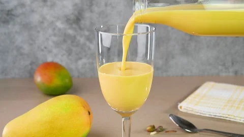 Serving mango lassi Stock Footage 308315506