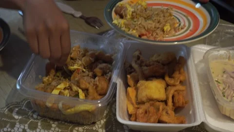 Serving marian food in plastic containers on a plate Stock Footage 154812894