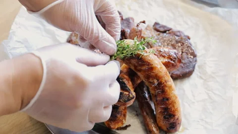 Serving meat and sausages to the table Stock Footage 107886404