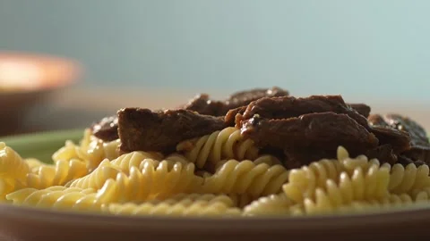 Serving Meat Over Pasta on Plate. Stock Footage 260340537