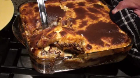 Serving moussaka Stock Footage 25611068