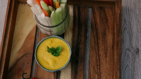 Serving Orange Dip Sauce with Vegetable Sticks on Tray. Top View. Eating Vegan Stock Footage 107149076