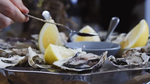 Serving oysters in a fish restaurant. Stock Footage 131412236