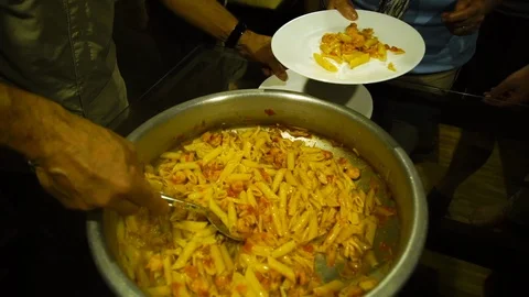 Serving pasta to the citizens Stock Footage 98538839